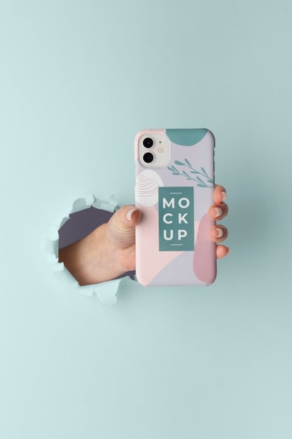 Free Hand Holding Smartphone With Mock-Up Phone Case Through Wall Tear Psd