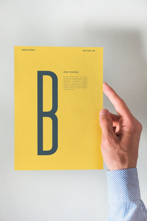 Free Hand Holding Yellow Paper Mockup Psd