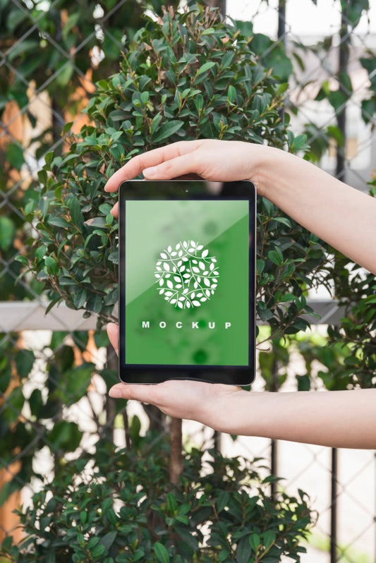 Free Hands Holding Tablet Mockup With Gardening Concept Psd