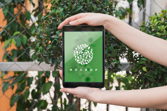 Free Hands Holding Tablet Mockup With Gardening Concept Psd
