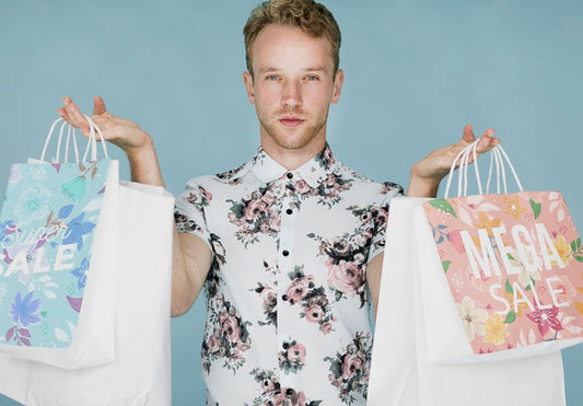 Free Handsome Man Holding Multiple Shopping Bags Psd