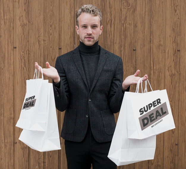 Free Handsome Man Holding Shopping Bags Psd