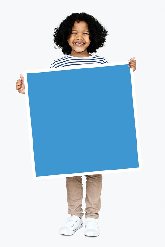 Free Happy Boy Holding A Blue Square Board