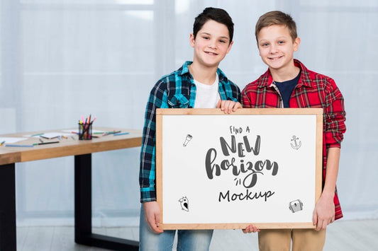 Free Happy Children Holding Mock-Up Sign Psd