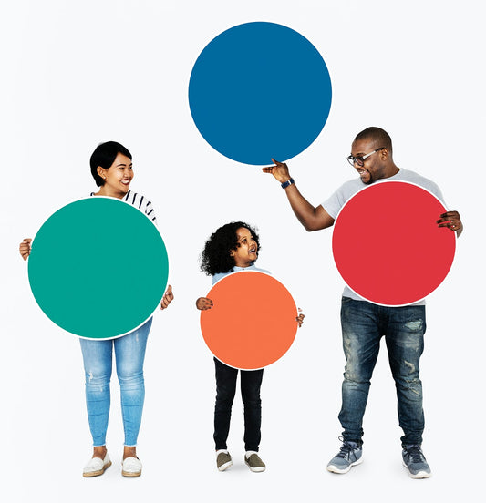 Free Happy Family Holding Round Colorful Boards