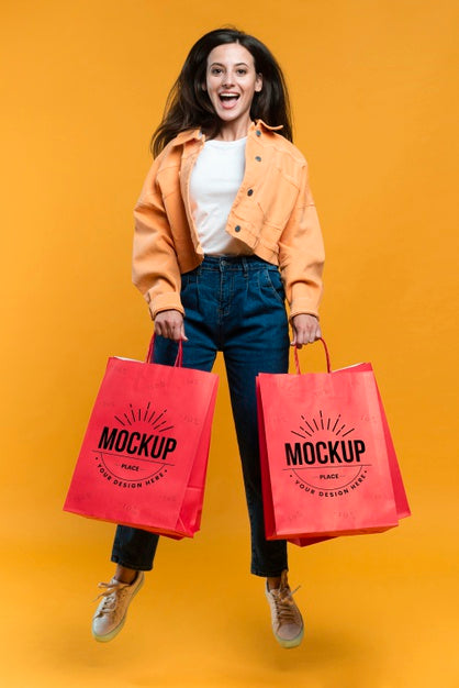 Free Happy Woman Holding Shopping Bags Psd