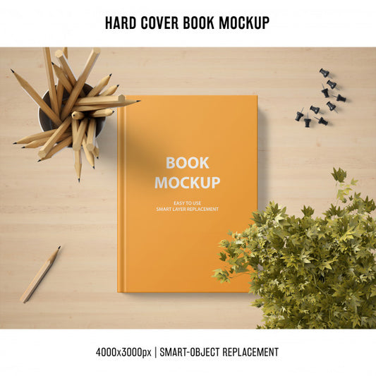 Free Hard Cover Book Mockup With Plant And Pencils Psd
