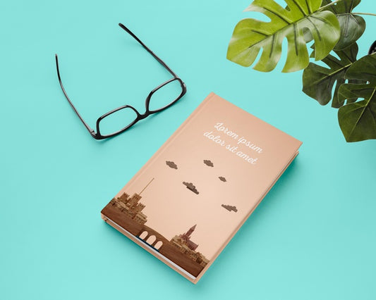 Free High Angle Book And Monstera Plant Psd