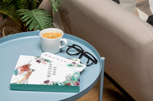 Free High Angle Book Mock-Up On Coffee Table With Glasses Psd