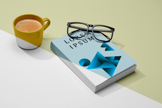 Free High Angle Book Mock-Up With Glasses And Coffee Psd