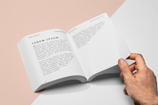 Free High Angle Hand Holding Page Of Open Book Mock-Up Psd