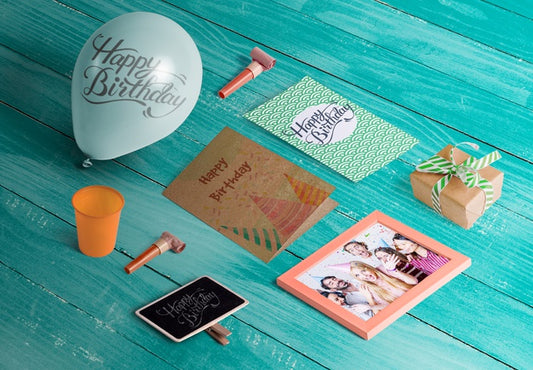 Free High Angle Of Birthday Elements On Wooden Table Psd
