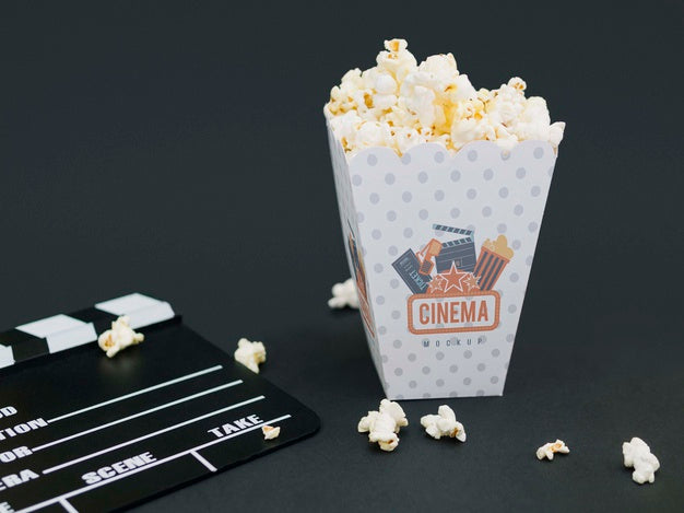 Free High Angle Of Cup With Popcorn And Cinema Clapperboard Psd