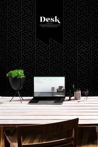 Free High Angle Of Desk With Laptop And Plant Pot Psd