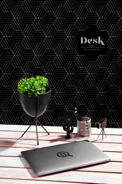 Free High Angle Of Desk With Plant And Laptop Psd