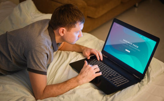 Free High Angle Of Man Working On Laptop From Home Psd