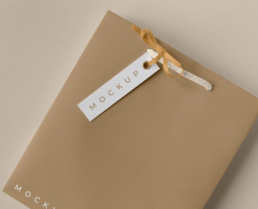 Free High Angle Of Paper Shopping Bag Mock-Up With Paper Tag Psd