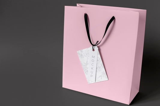 Free High Angle Of Paper Shopping Bag Mock-Up With Paper Tag Psd