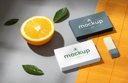 Free High Angle Of Paper Stationery With Citrus Fruit Psd
