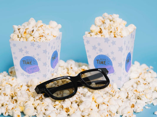 Free High Angle Of Popcorn With Glasses Psd