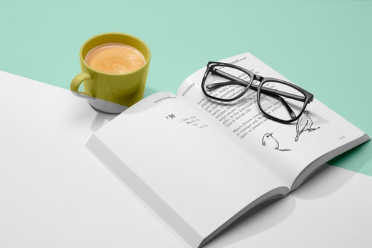 Free High Angle Open Book Mock-Up With Coffee And Glasses Psd