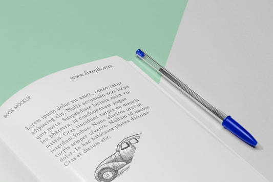 Free High Angle Open Book Mock-Up With Pen Psd