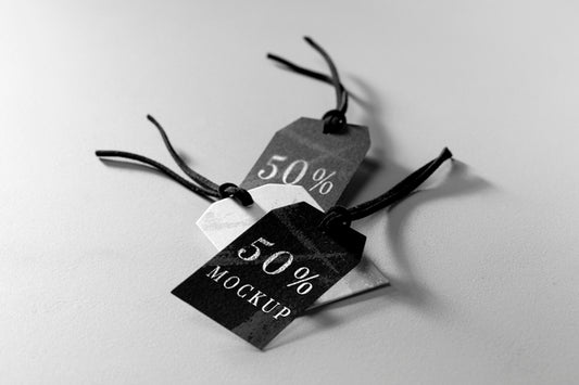 Free High View Mock-Up Arrangement Of Black And White Clothing Tags Psd