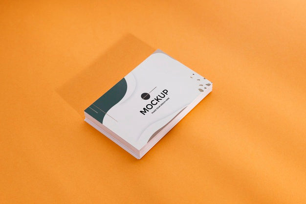Free High View Pile Of Business Cards On Orange Background Psd