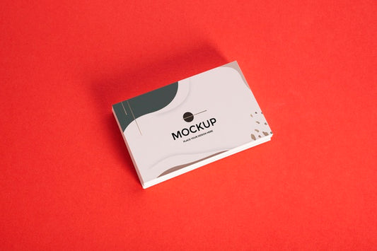 Free High View Pile Of Business Cards On Red Background Psd