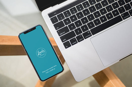Free iPhone X Mockup with Macbook on Glass Table