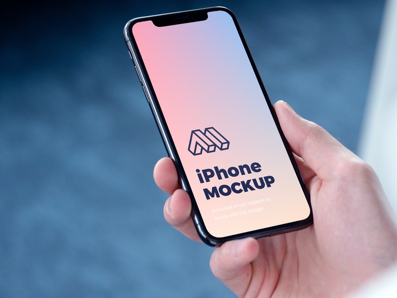 Free Iphone In Hand Psd Mockup   CreativeBooster