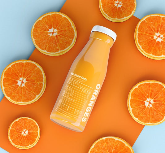 Free Isolated Bottle Of Fruit Juice And Slices Of Orange Psd