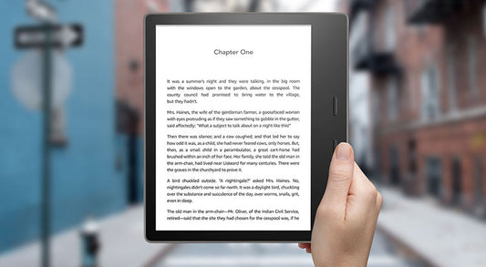 Free Kindle Oasis In Hand Mockup Psd