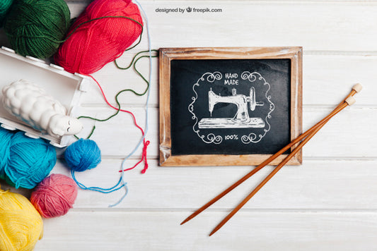 Free Knitting Concept With Sticks On Slate Psd
