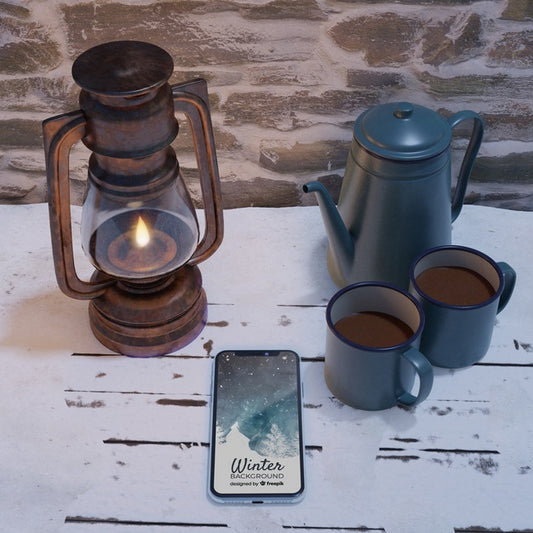 Free Lantern And Kettle With Hot Tea Beside Mobile Psd