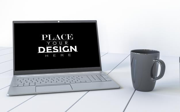 Free Laptop And Mug On Desk In Workspace Mockup Psd