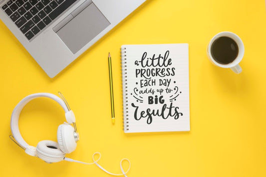 Free Laptop Coffee Headphones And Notebook On Yellow Background Psd