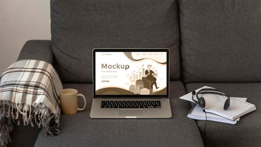 Free Laptop Mock-Up On Gray Sofa Psd