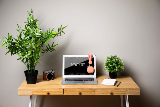 Free Laptop Mock-Up With Headphones And Camera Psd