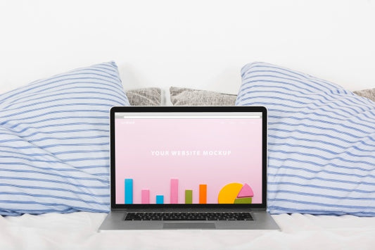 Free Laptop Mockup On Bed Psd