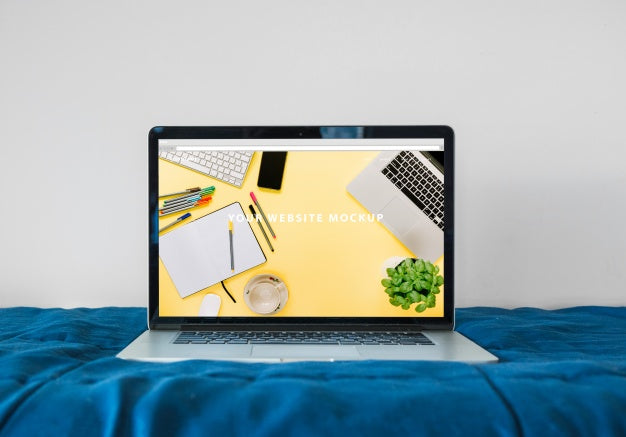 Free Laptop Mockup On Bed Psd