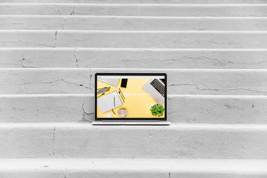 Free Laptop Mockup On Stairs Psd