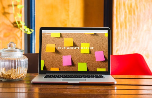 Free Laptop Mockup On Wooden Table Psd