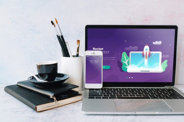 Free Laptop Mockup On Workspace Table Psd