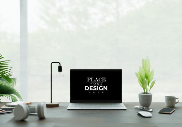 Free Laptop On Desk In Workspace Mockup Psd