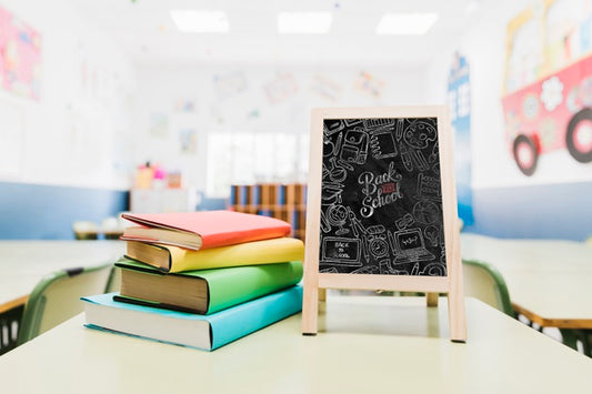 Free Little Blackboard Mock-Up Next To Colorful Books Psd