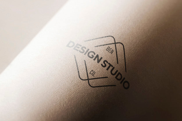 Free Logo Mockup In Curved Paper Psd