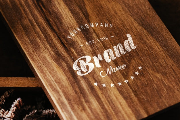 Free Logo On Wooden Table Mock Up Psd