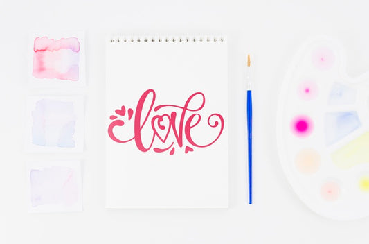 Free Love Message On Notebook With Brush Beside Psd