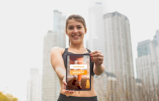 Free Low View Fit Woman Holding Digital Tablet Mock-Up Psd